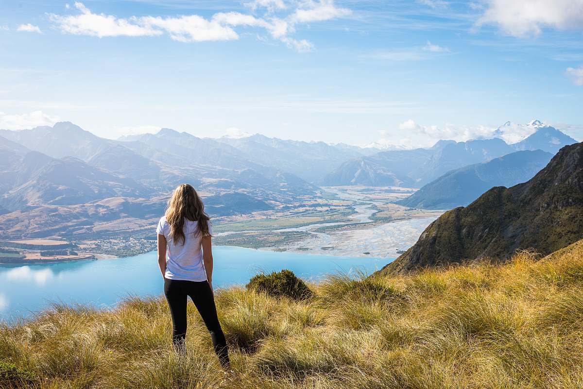 person woman standing front of body of water people