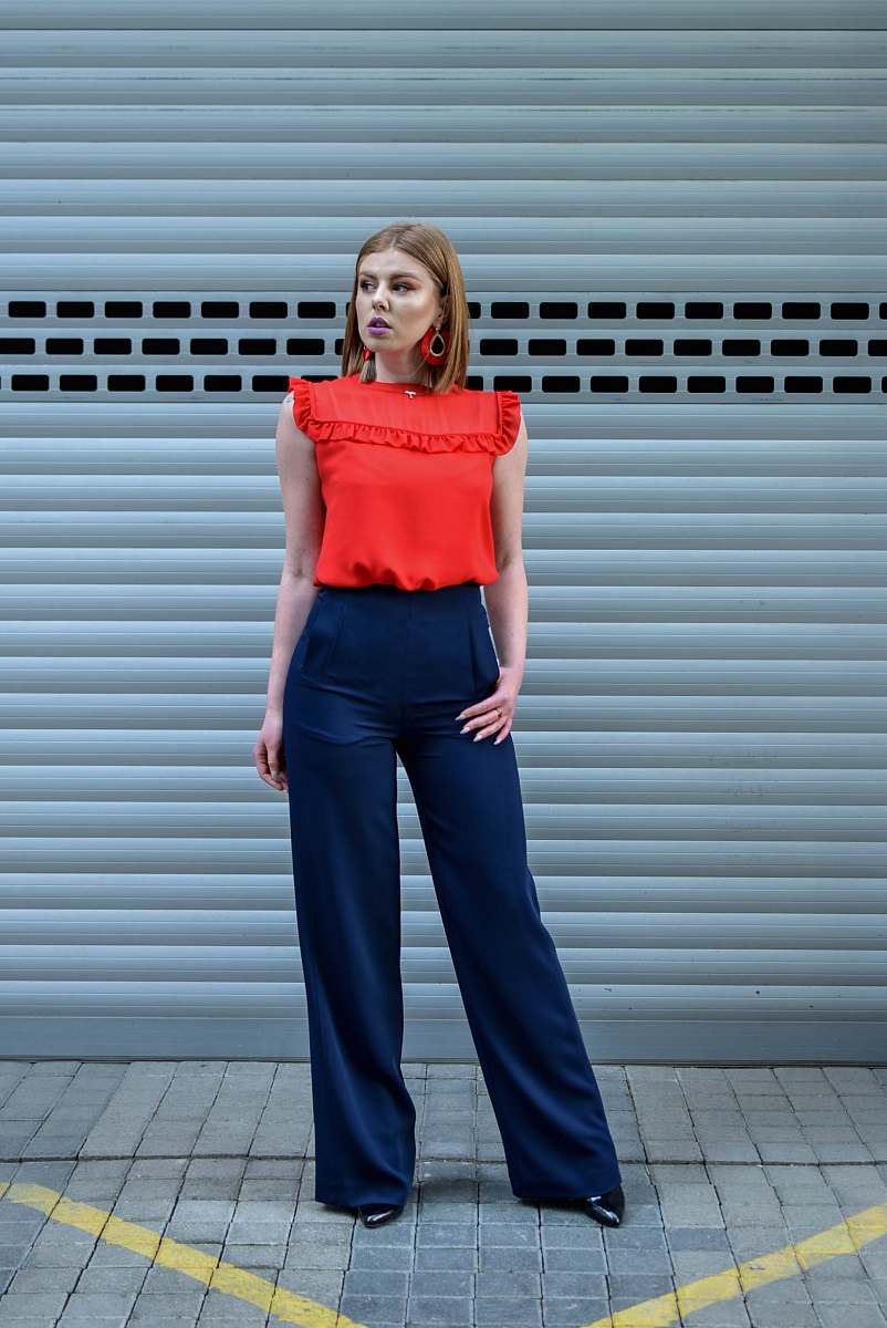 people woman standing in front of roller shutter person