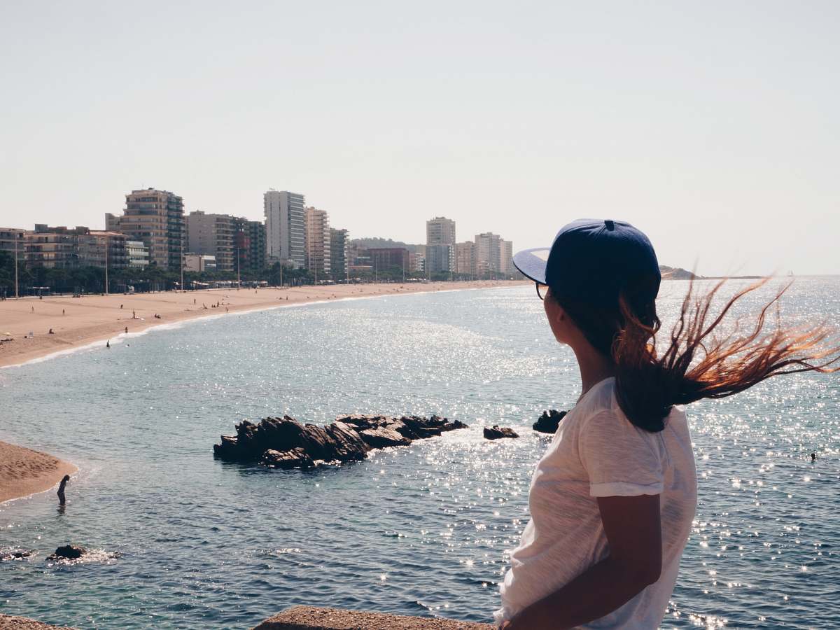 people woman standing in front of seashore person