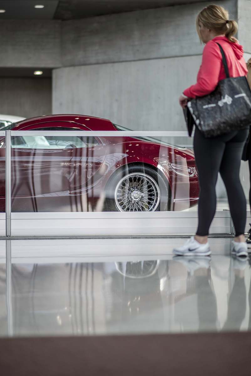 people woman standing near coupe car during daytime person