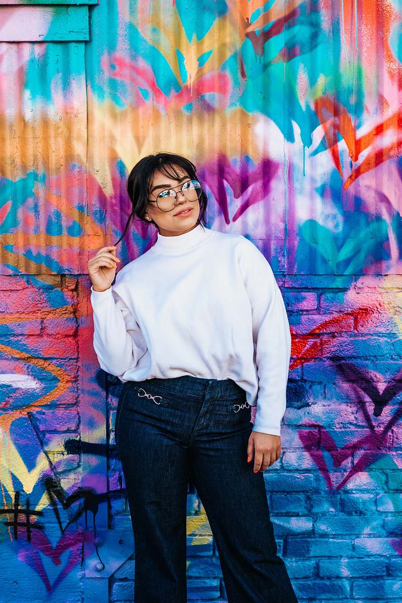 person woman standing near wall people