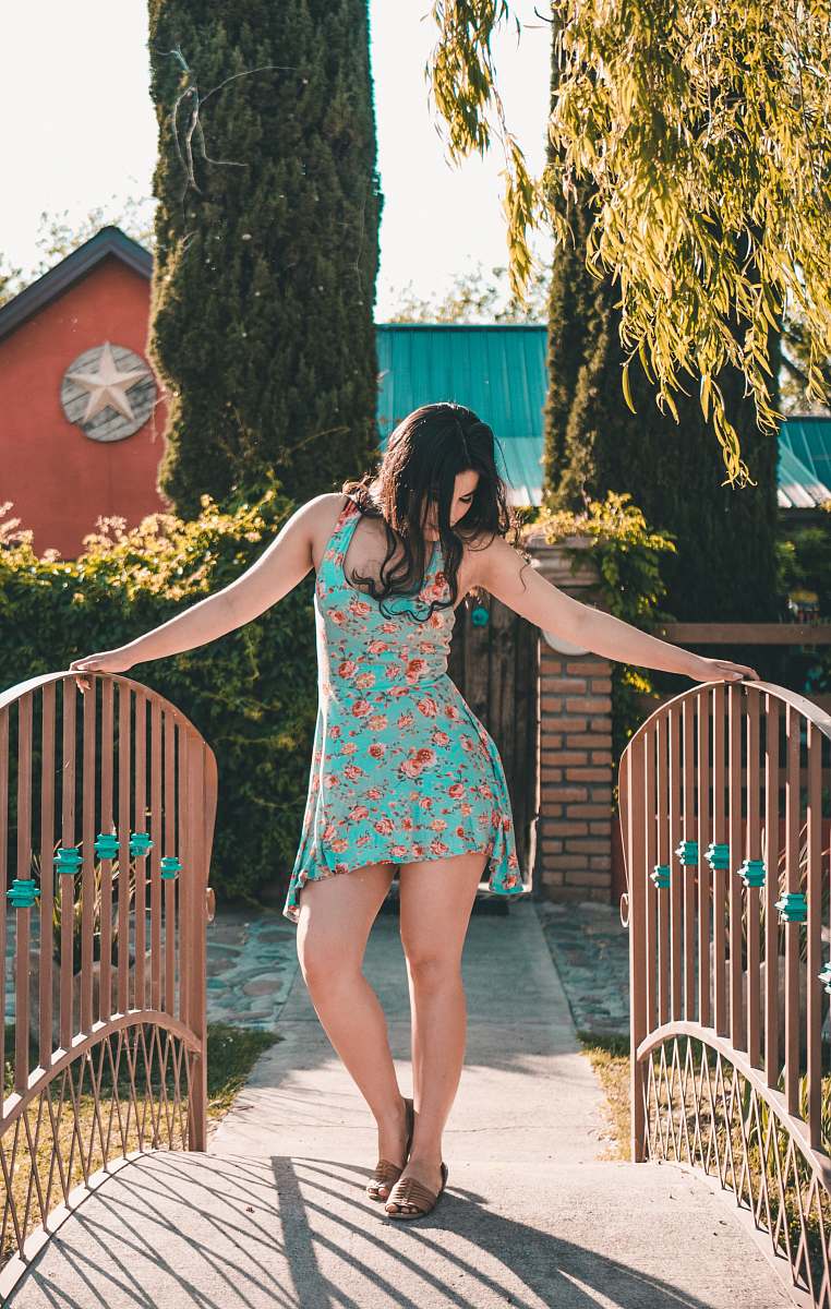 people woman standing on bridge holding the balustrades at daytime person