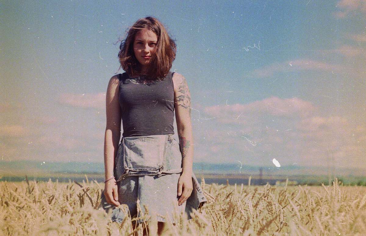 people woman standing on brown field person