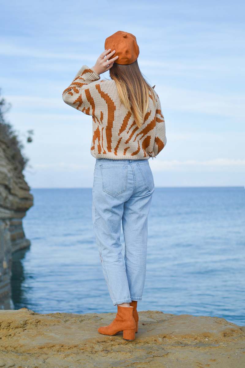 people woman standing on cliff staring at horizon person