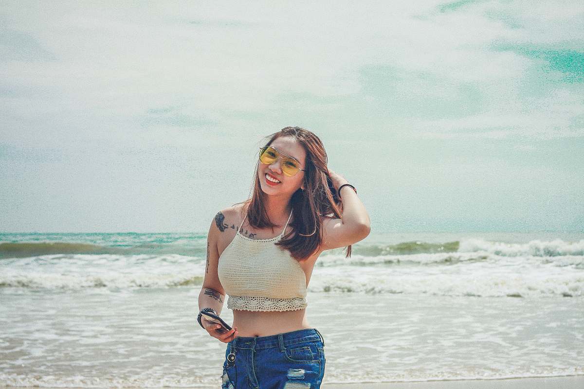 people woman standing while holding her hair person