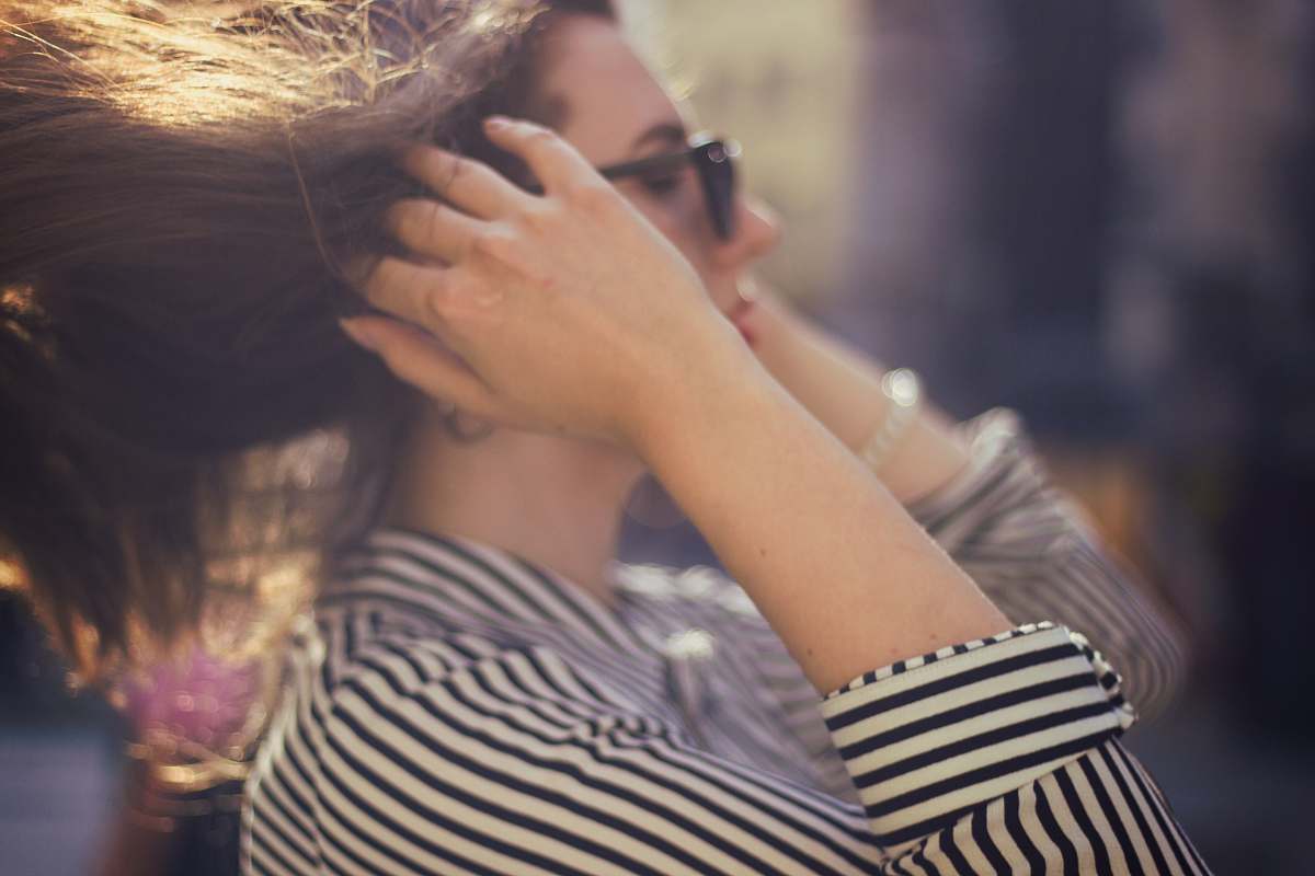 people woman touching her hair person