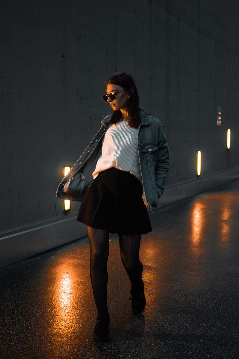 people woman walking through concrete road person