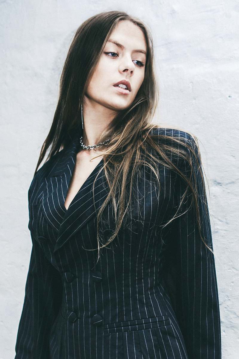 people woman wearing black blazer person