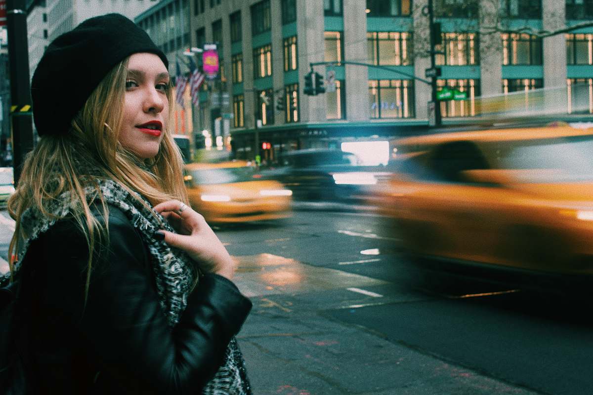 people woman wearing black leather jacket standing on street person