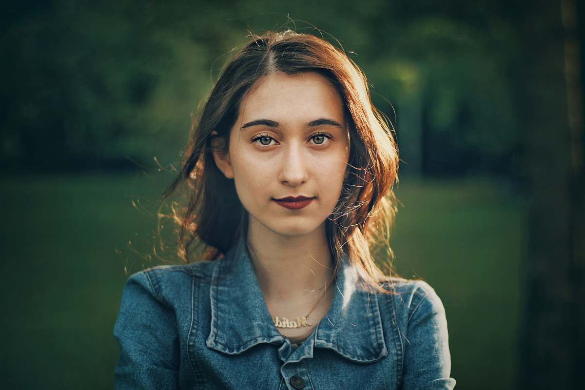 people woman wearing blue button-up denim jacket person