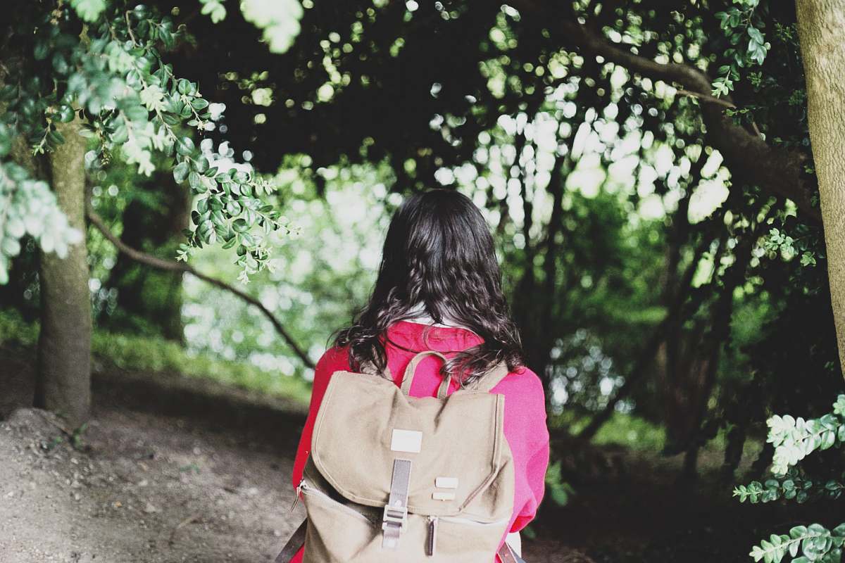 people woman wearing brown backpack person