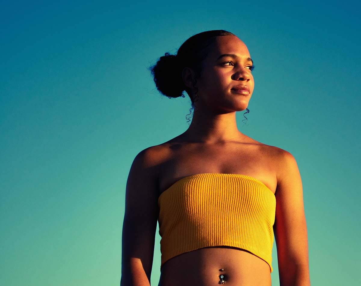 people woman wearing yellow tube top person