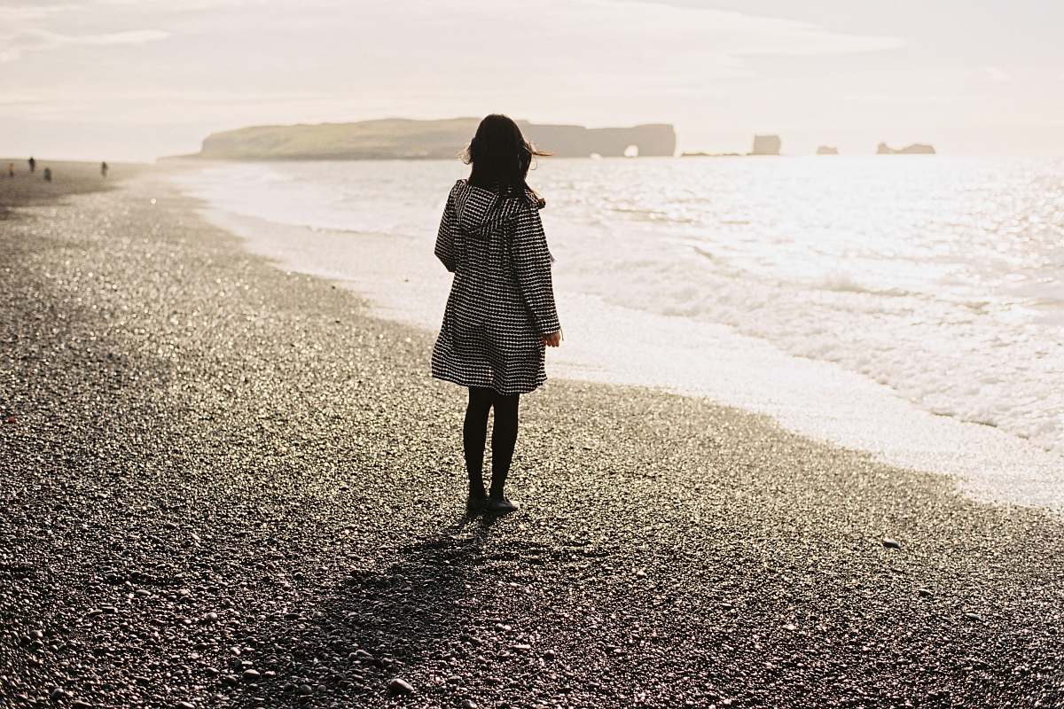 people women wearing white long-sleeved shirt on seashore person