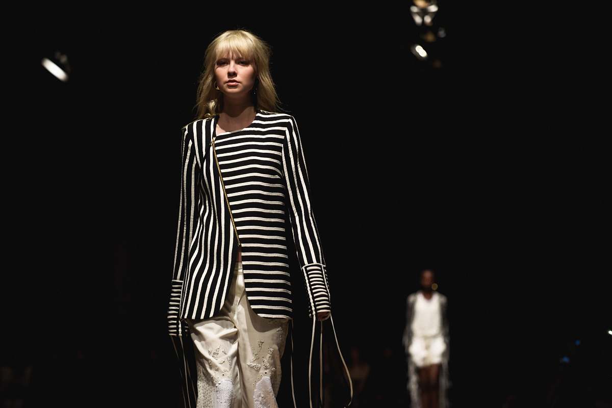 person women's black and white striped coat people