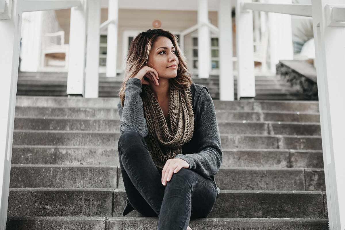 person women's gray knit scarf people