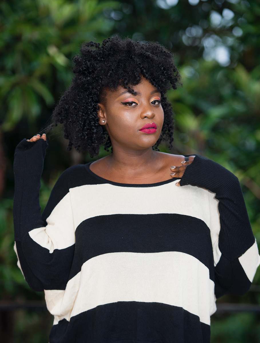 person women's white and black striped top hair