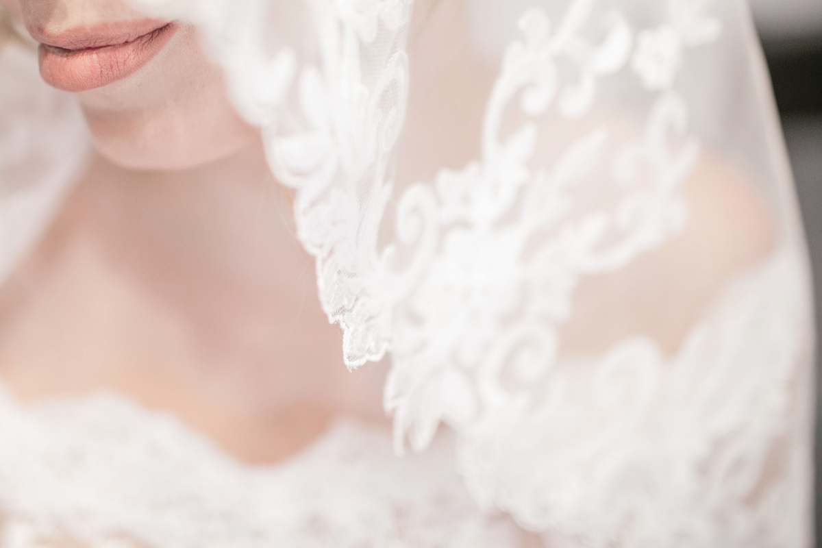 wedding macro shot of white veil bride
