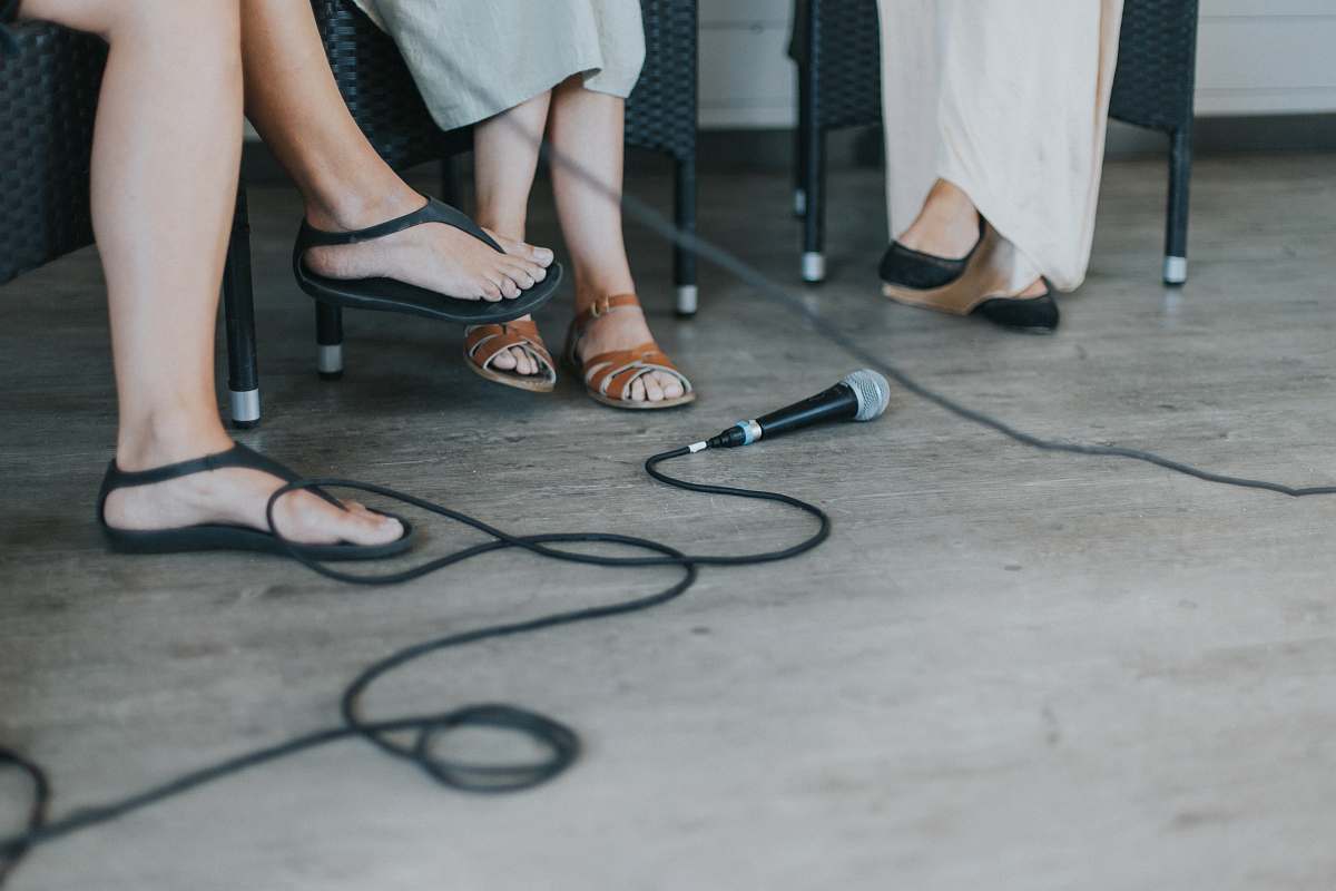 human black microphone on floor shoe