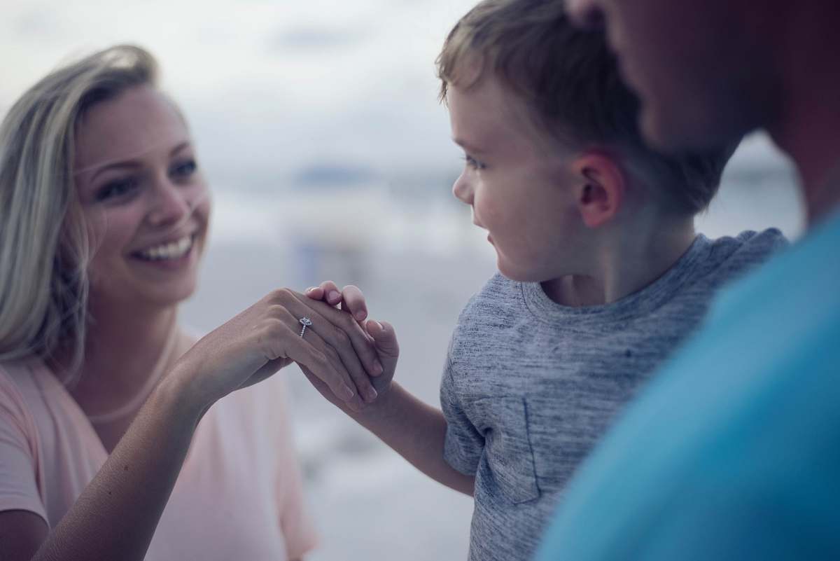 human boy holding womans hand person