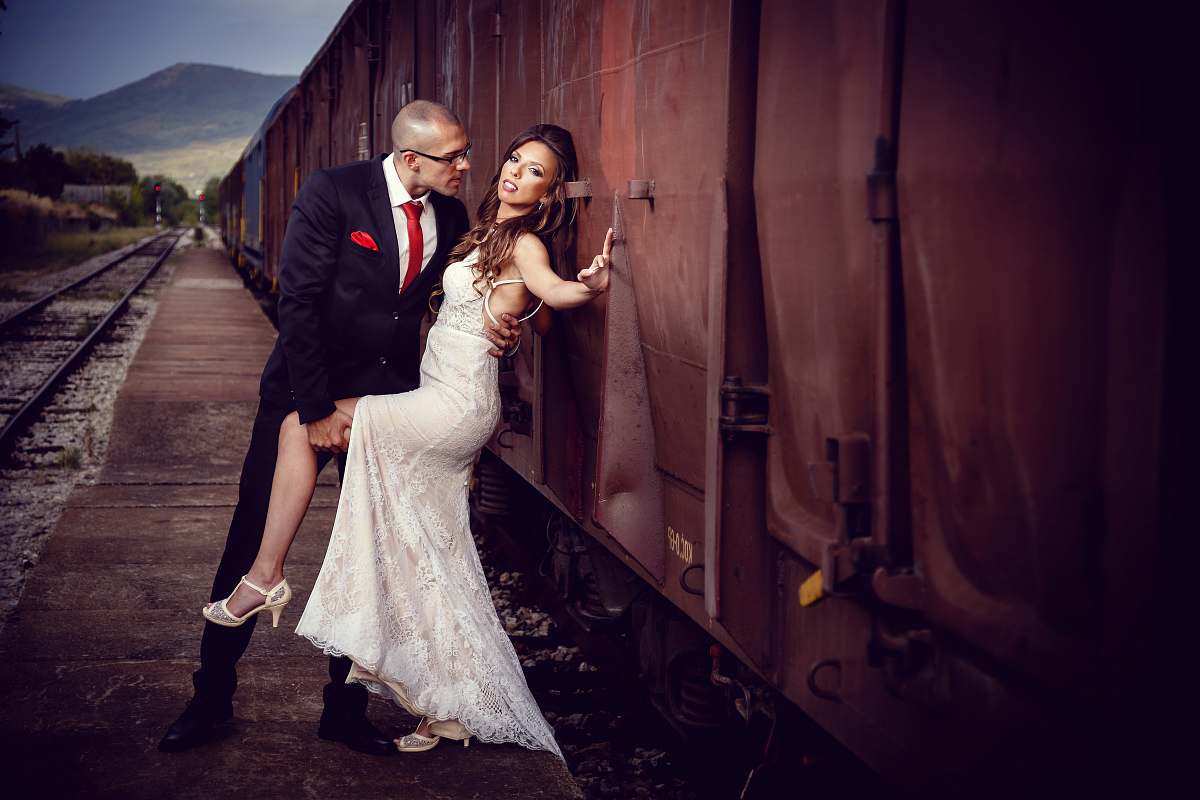 human bride and groom beside train during daytime person