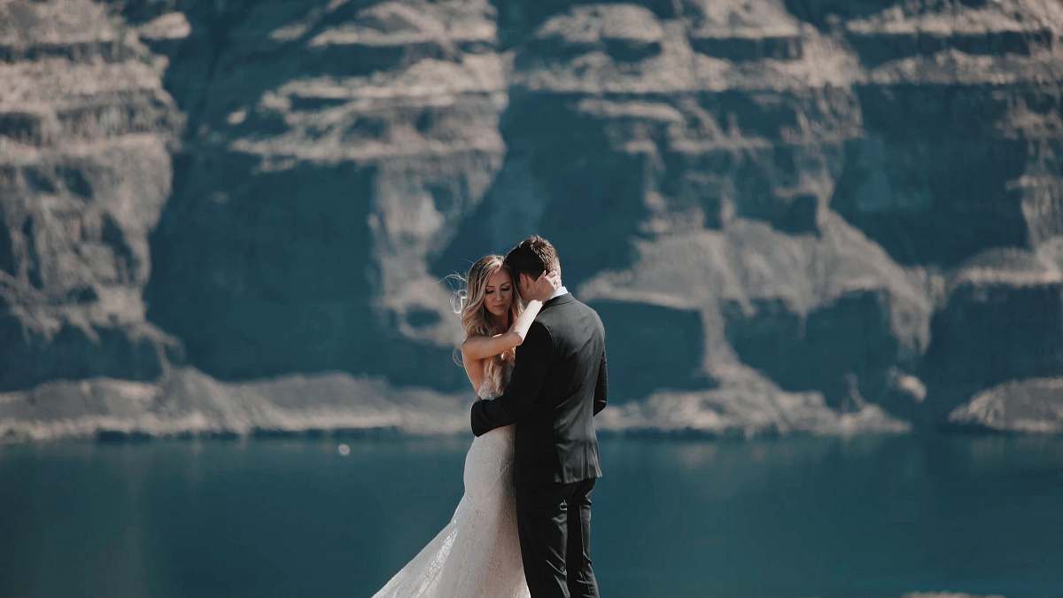 human bride and groom hugging wedding