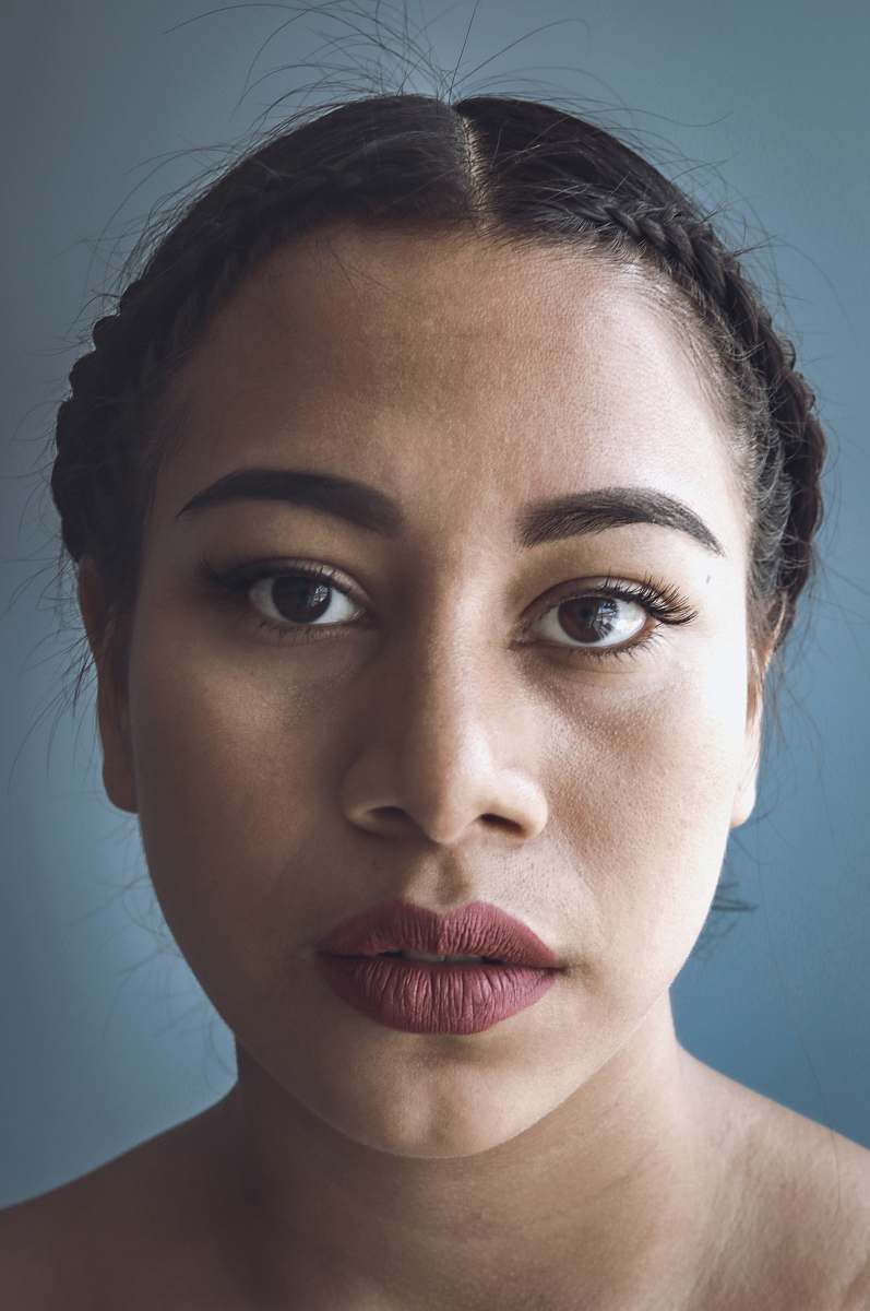 human close-up photo of woman's face with red lipstick person