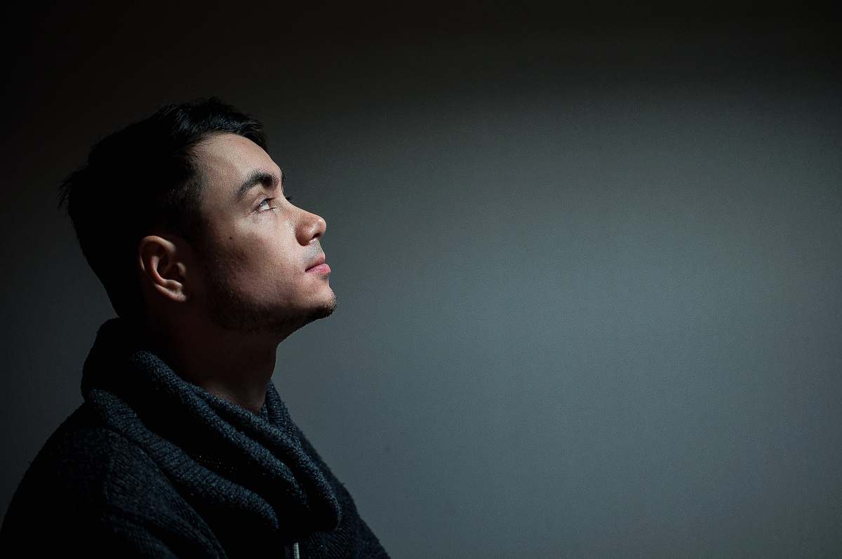 person close-up photography of man wearing black top human