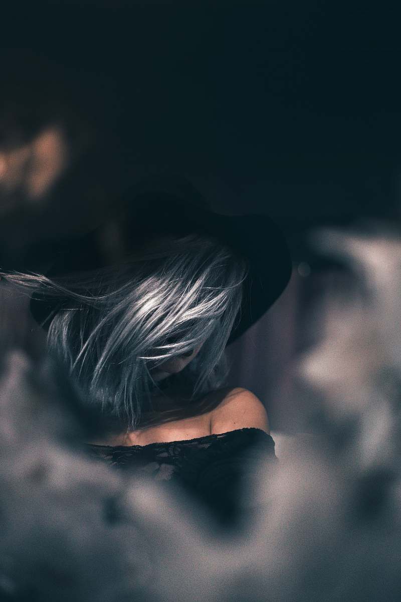 human closeup photo of woman wearing off-shoulder top person