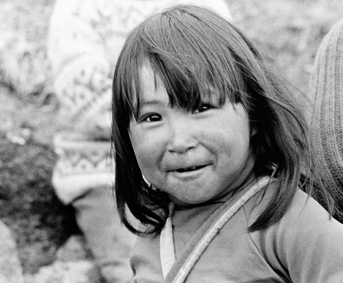 person girl smiling at the camera black-and-white