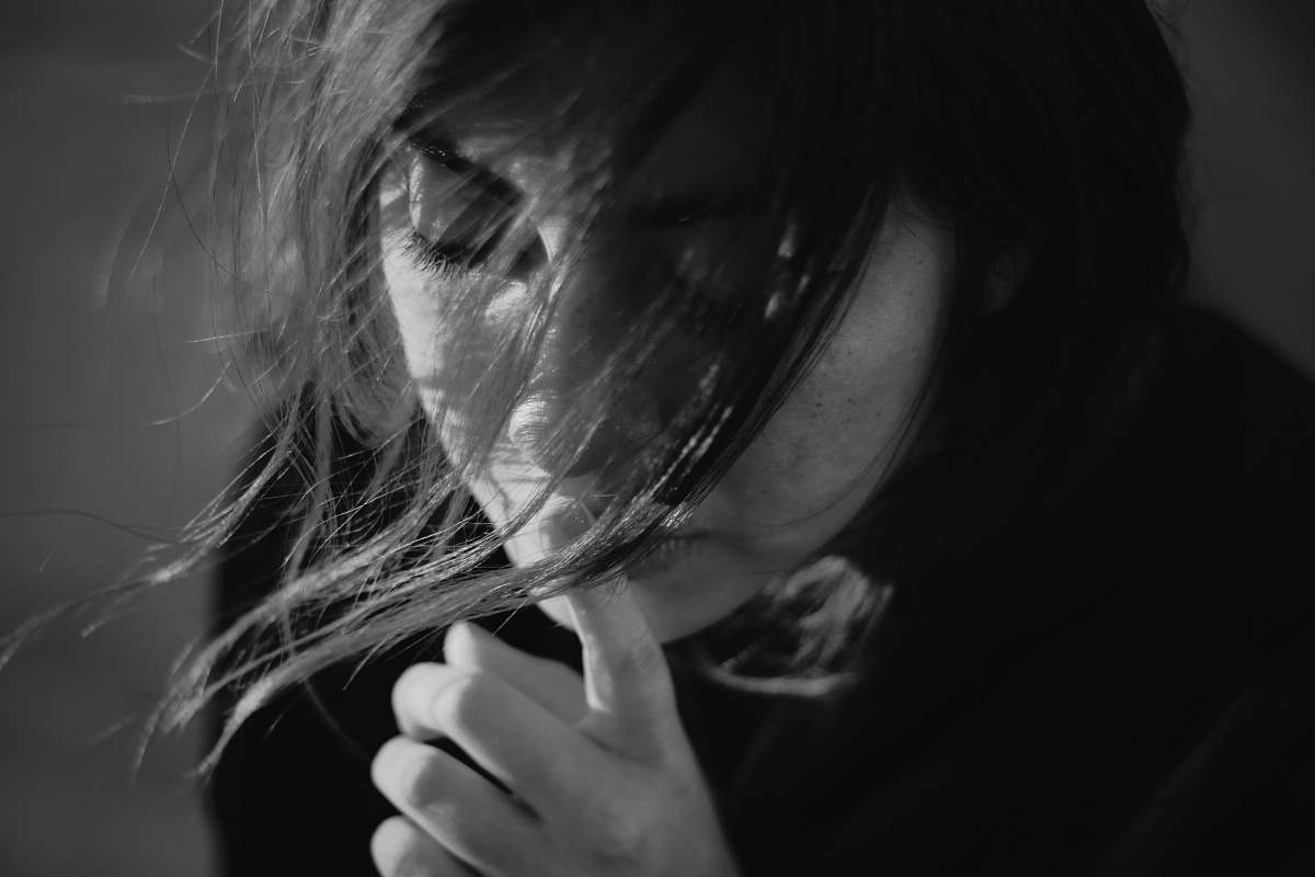human grayscale photography of black top black-and-white