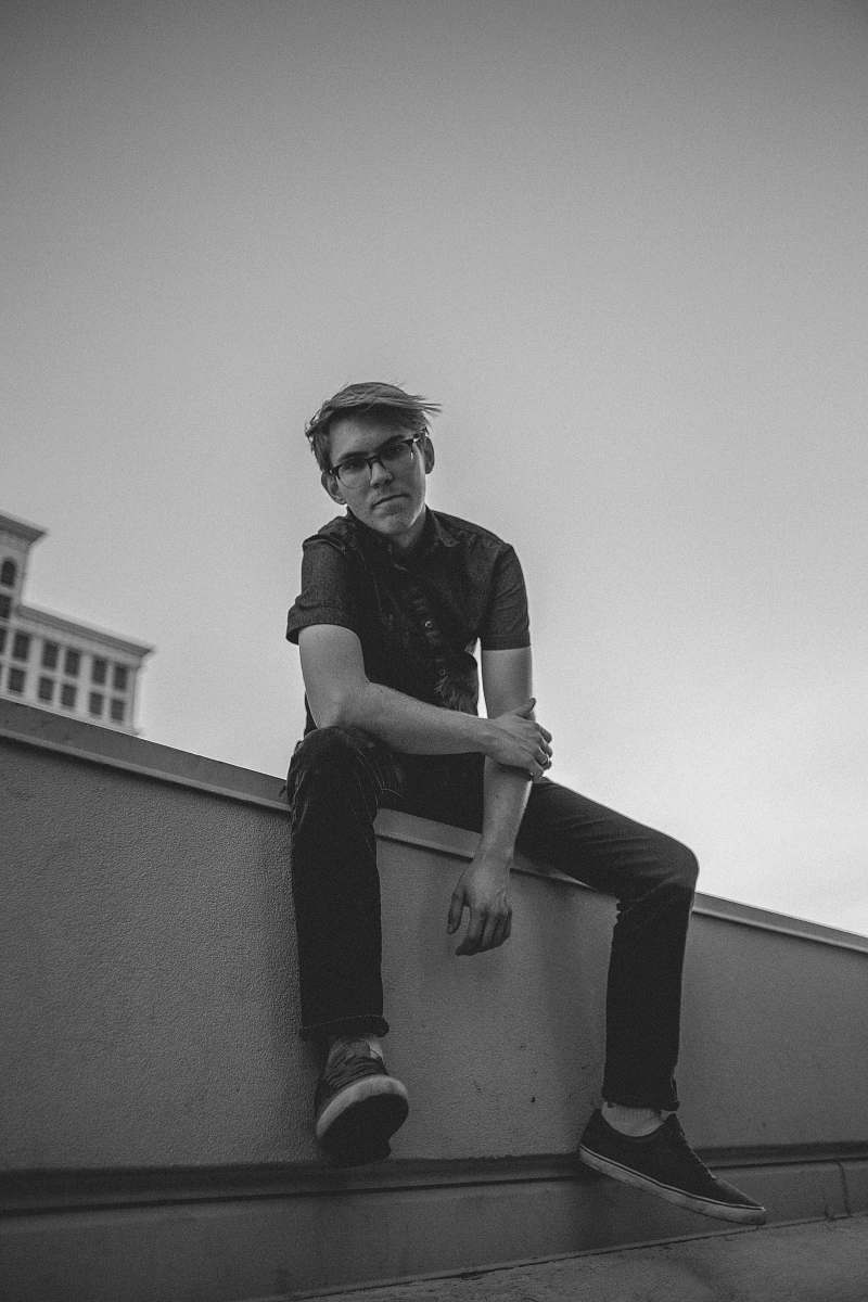 person grayscale photography of man in shirt black-and-white