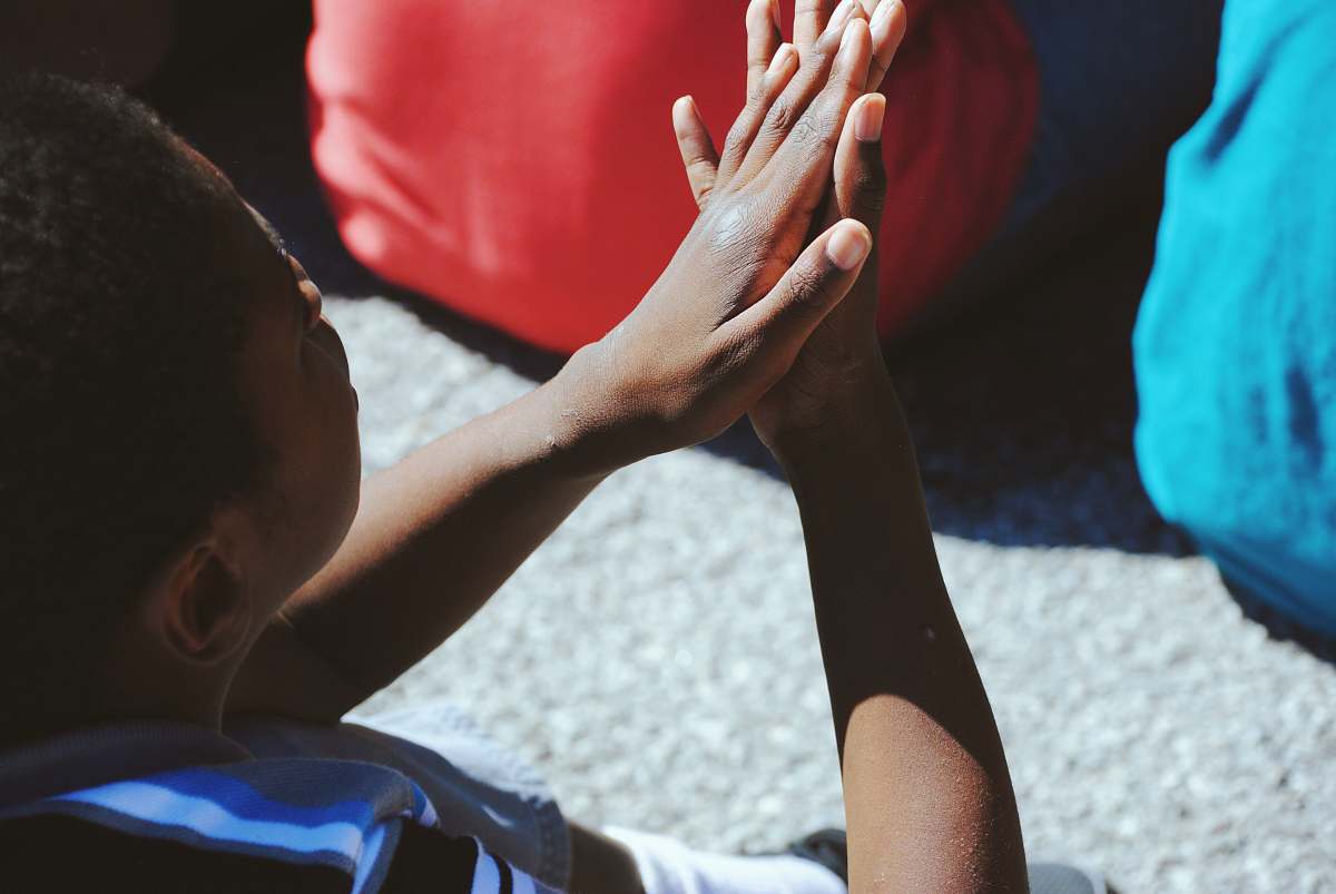 person man clapping his hand during daytime fayetteville