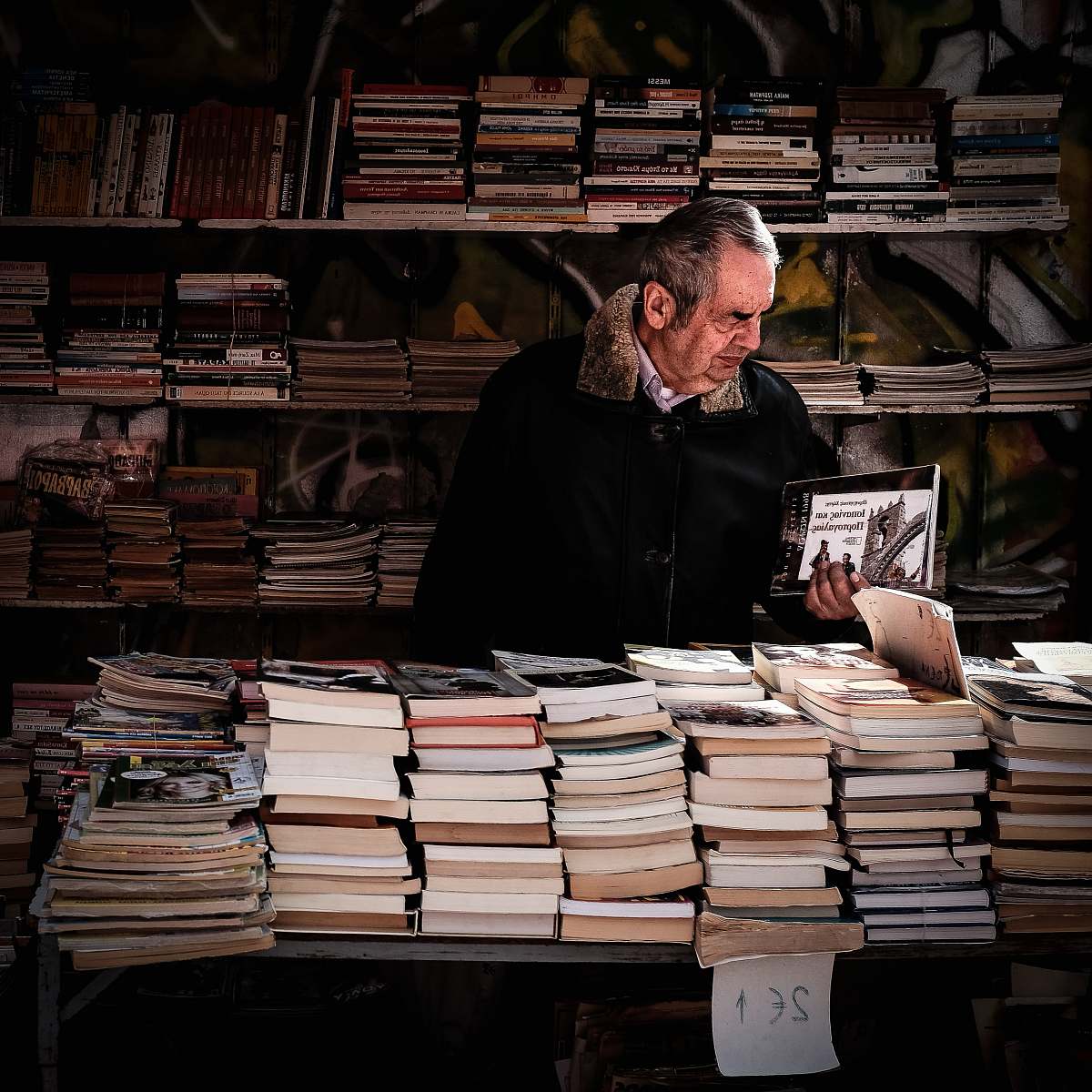 book man holding book near library greece