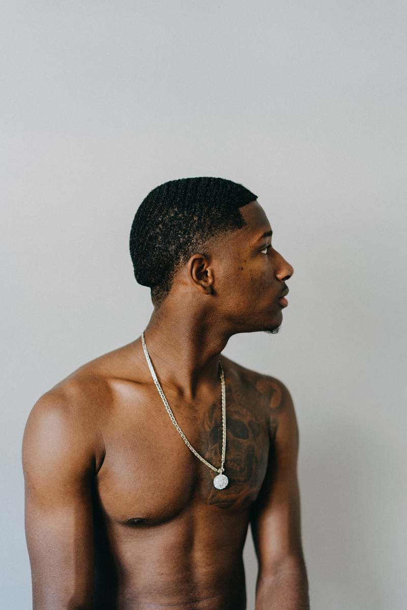 human man in silver-colored necklace person