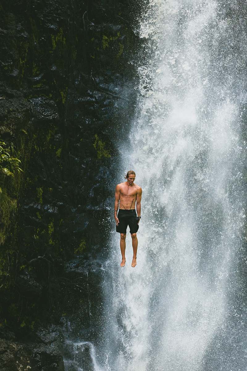 person man jumps in waterfalls human