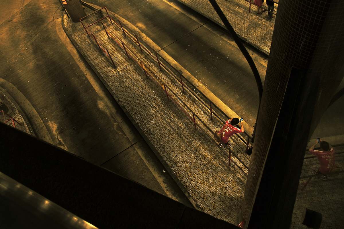 person man leaning on brown fence human