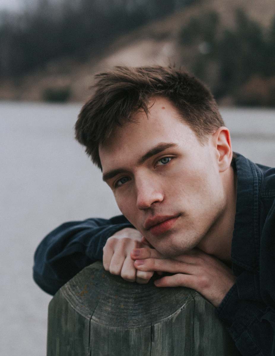 human man lying on tree branch person