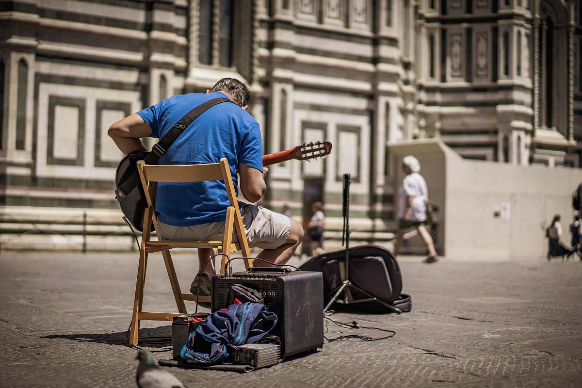 human man playing guitar person