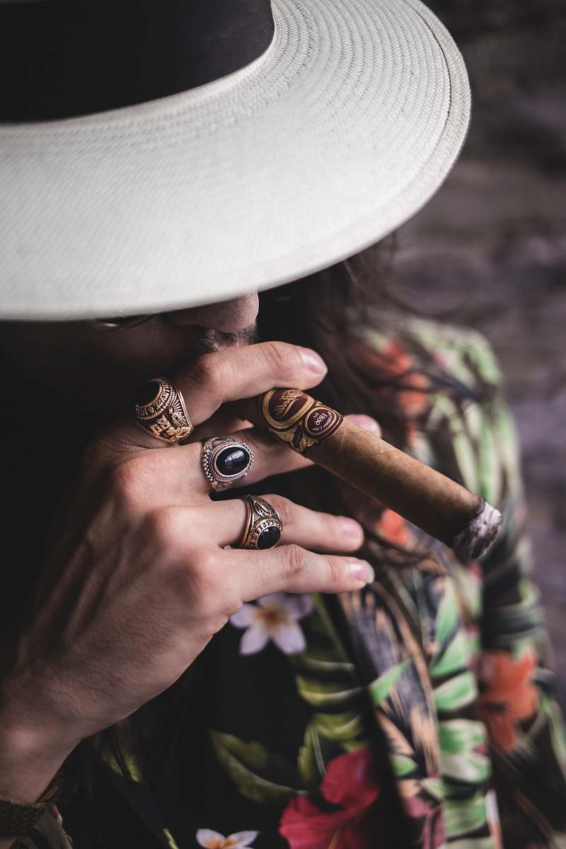 jewelry man smoking cigar ring