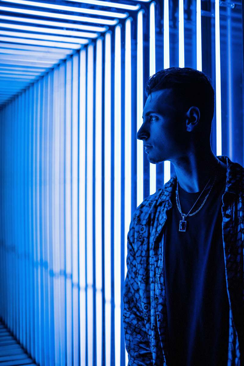 human man standing beside LED lights person