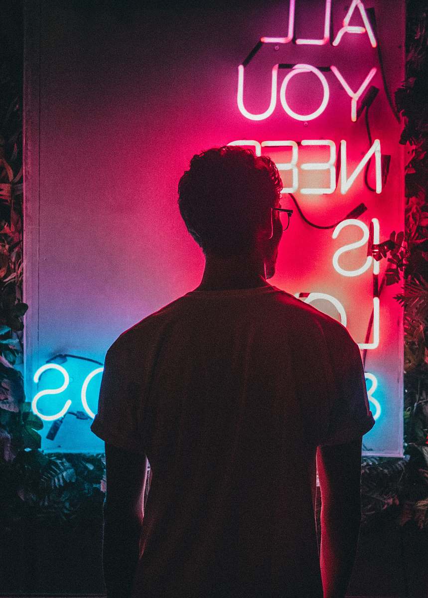 human man standing beside signage person