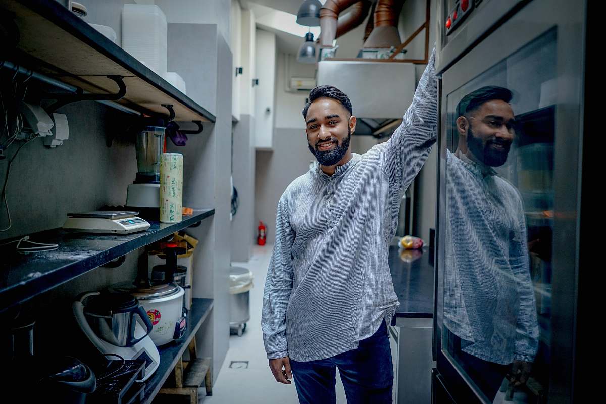 person man standing in kitchen human