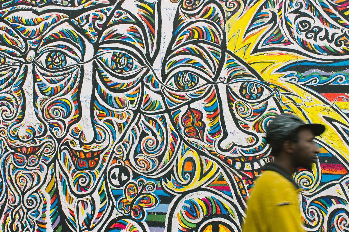 human man standing near graffiti art person