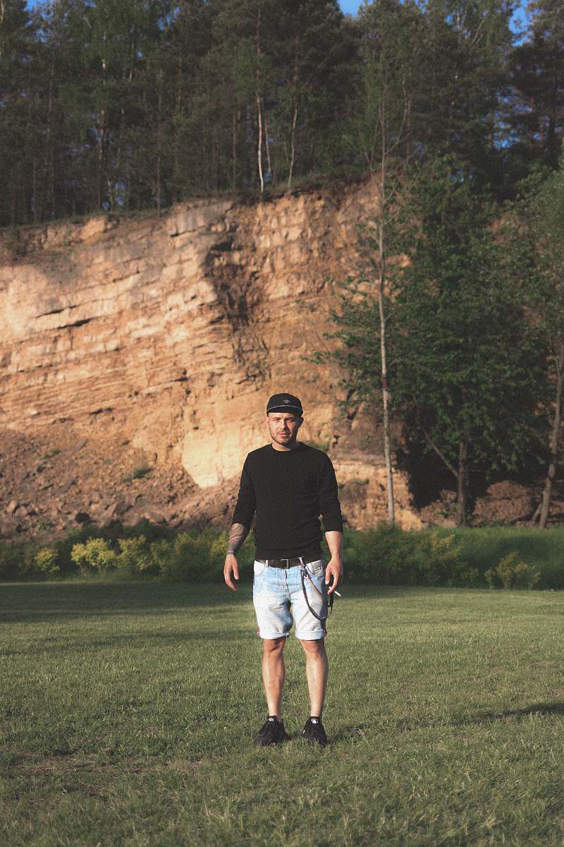 person man standing on green grass field human