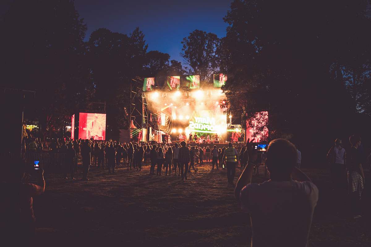 human man taking a picture of concert person