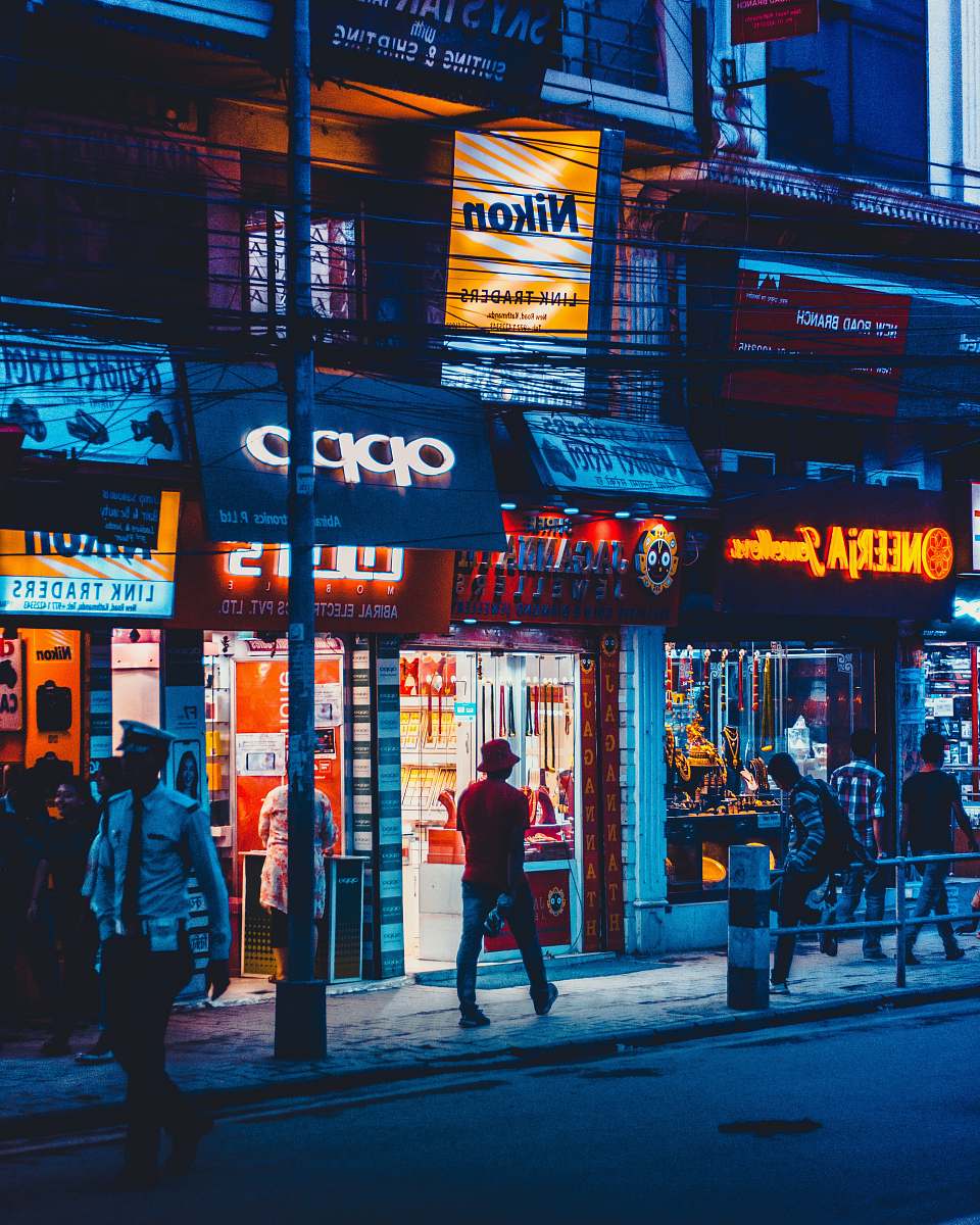 human man walking beside OPPO front store person