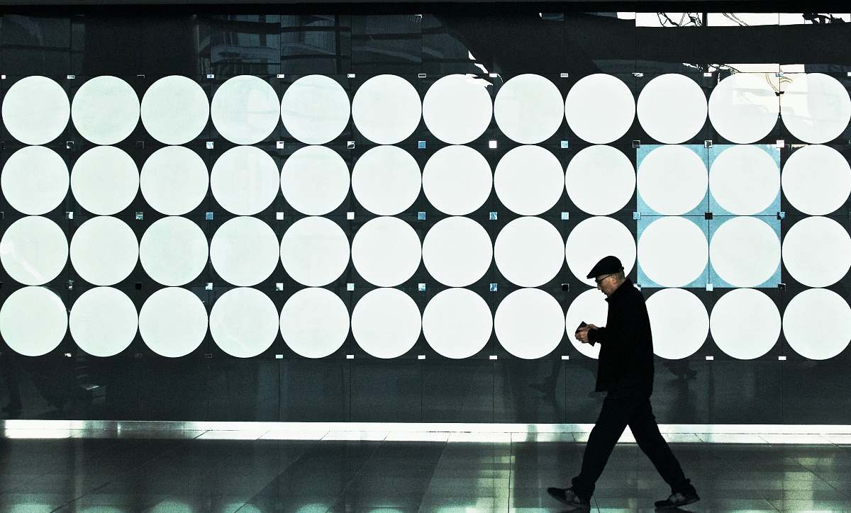 human man walking near lights person