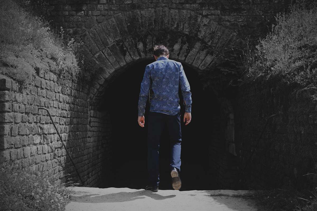human man walking to tunnel person