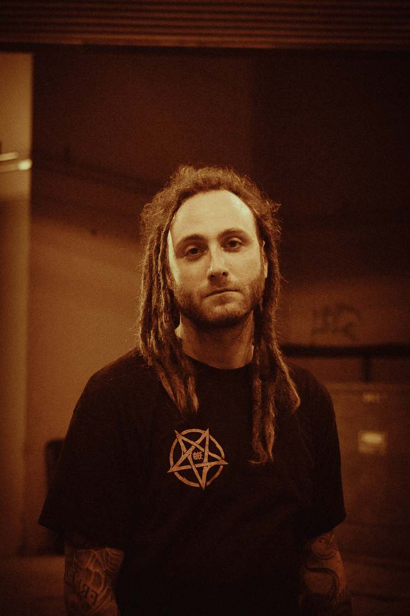 human man wearing black crew-neck t-shirt person