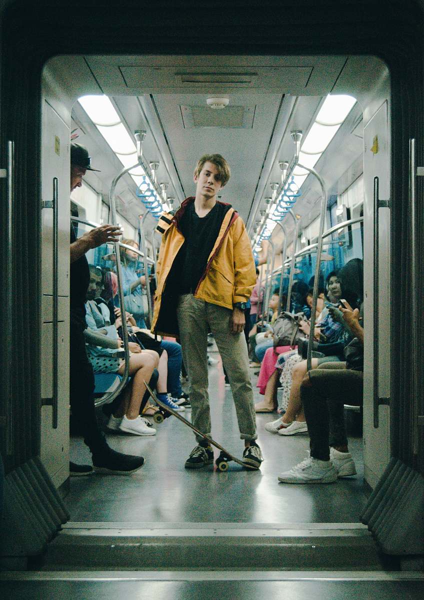 human man wearing gray pants inside train person
